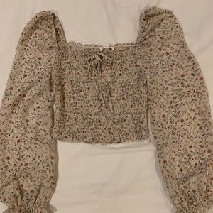 Flower cropped blouse with trumpet sleeves